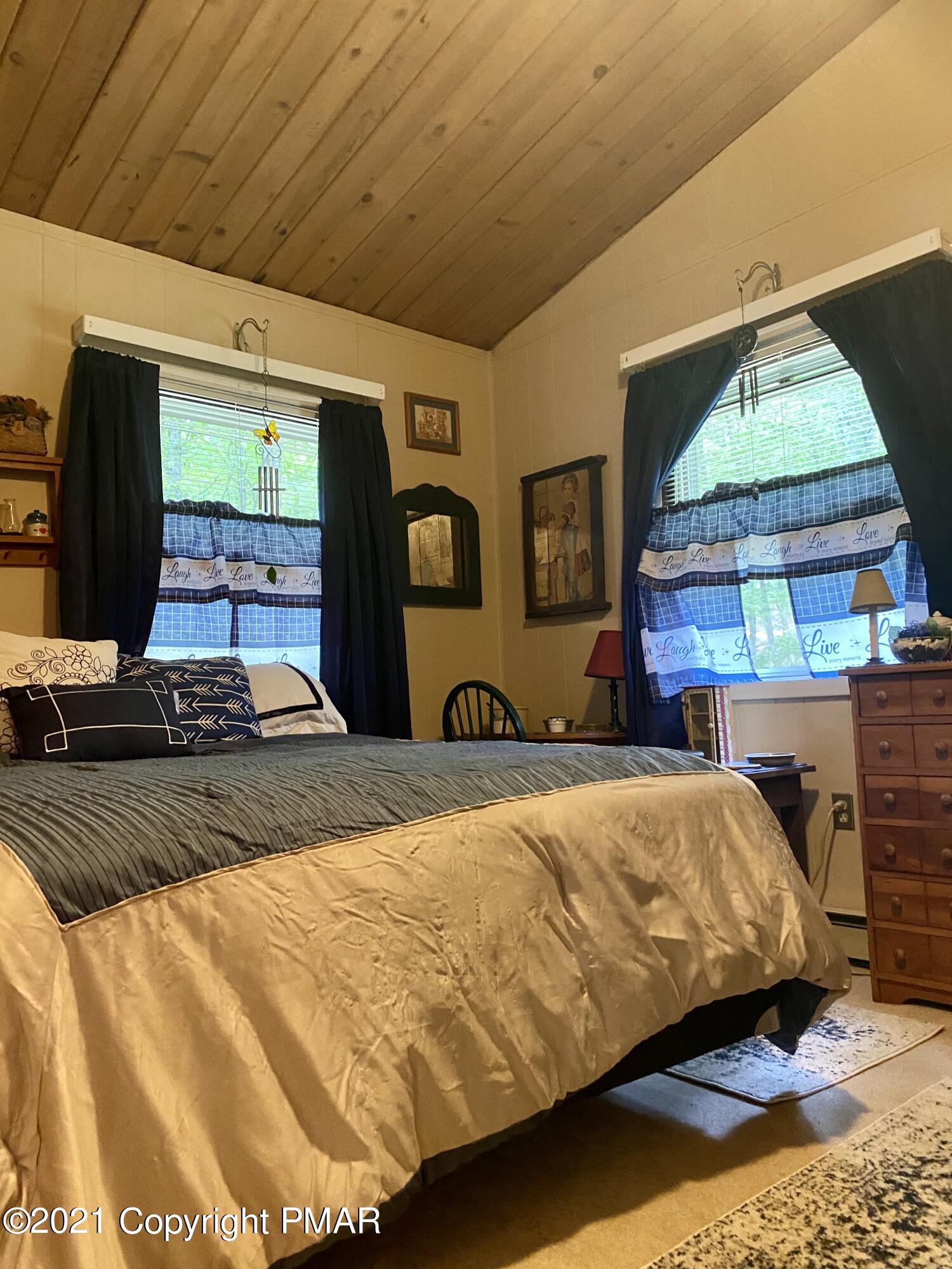 155 Chipmunk Road Bushkill, PA 18324 - Photo 18 of 18 a bedroom with a bed and window
