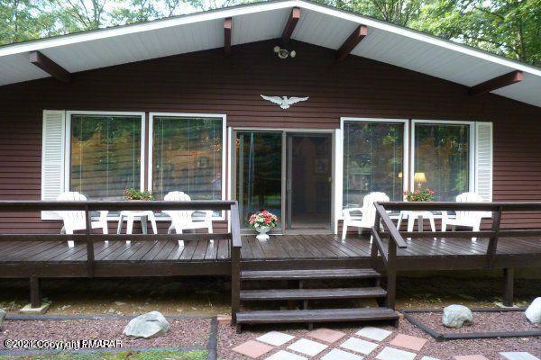 155 Chipmunk Road Bushkill, PA 18324 - Photo 2 of 18 a front view of a house with balcony