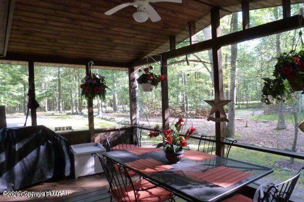155 Chipmunk Road Bushkill, PA 18324 - Photo 8 of 18 a view of a dining room with furniture window and outside view