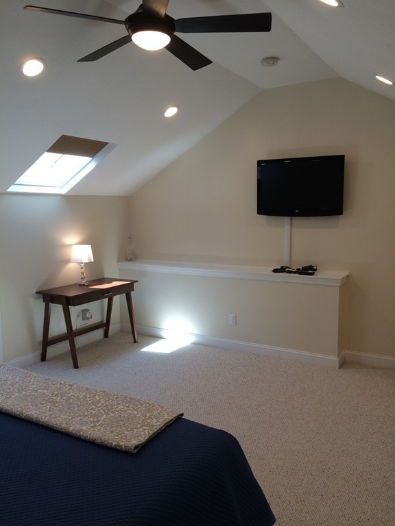 22 Whispering Pine Circle, Unit 29 Worcester, MA 01606 - Photo 20 of 30 a room with furniture and a lamp