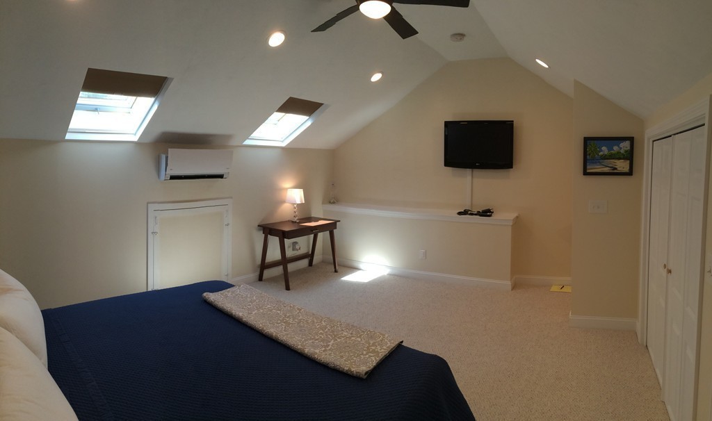 22 Whispering Pine Circle, Unit 29 Worcester, MA 01606 - Photo 24 of 30 a view of a livingroom with furniture and a flat screen tv
