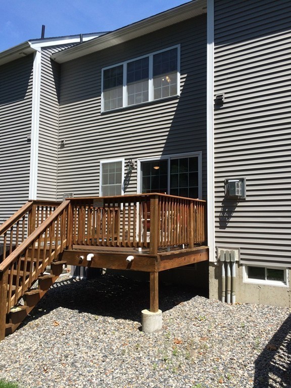 22 Whispering Pine Circle, Unit 29 Worcester, MA 01606 - Photo 30 of 30 a view of a house with wooden deck