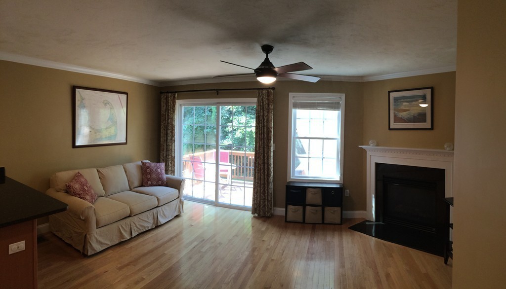 22 Whispering Pine Circle, Unit 29 Worcester, MA 01606 - Photo 4 of 30 a living room with furniture and a fireplace