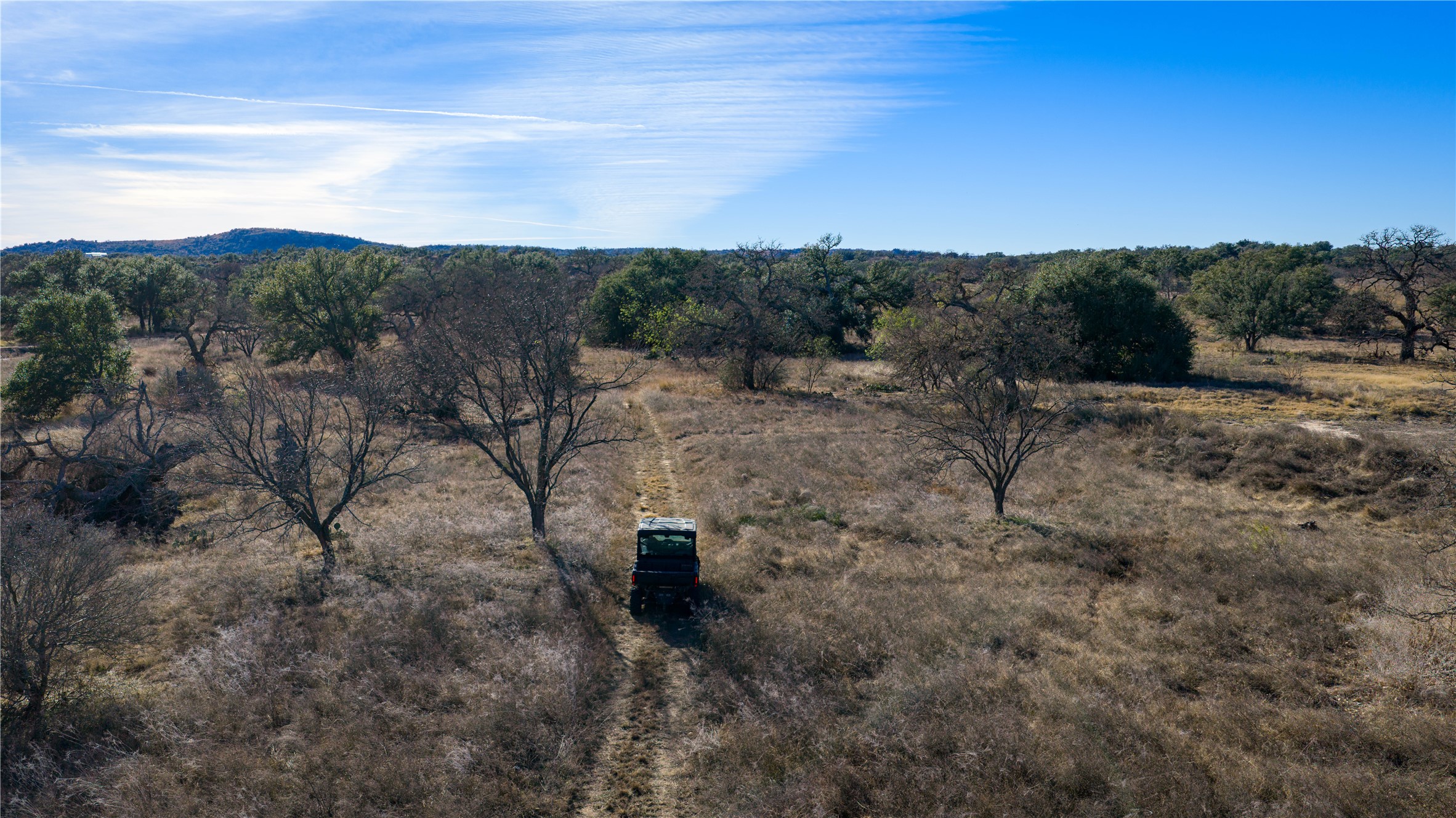 126 Buffalo Rd Valley Spring Valley Spring, TX 76885 - Photo 28 of 39 View of mountain background featuring rural landscape