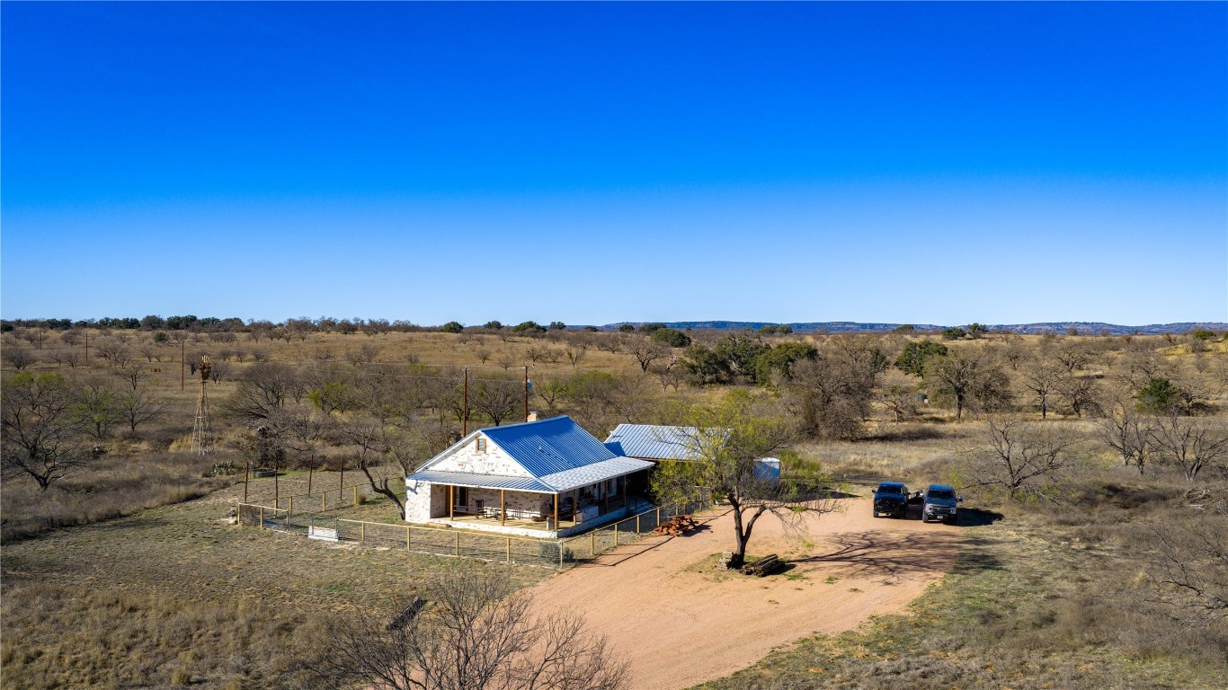 126 Buffalo Rd Valley Spring Valley Spring, TX 76885 - Photo 29 of 39 a view of a lake with a mountain in the background