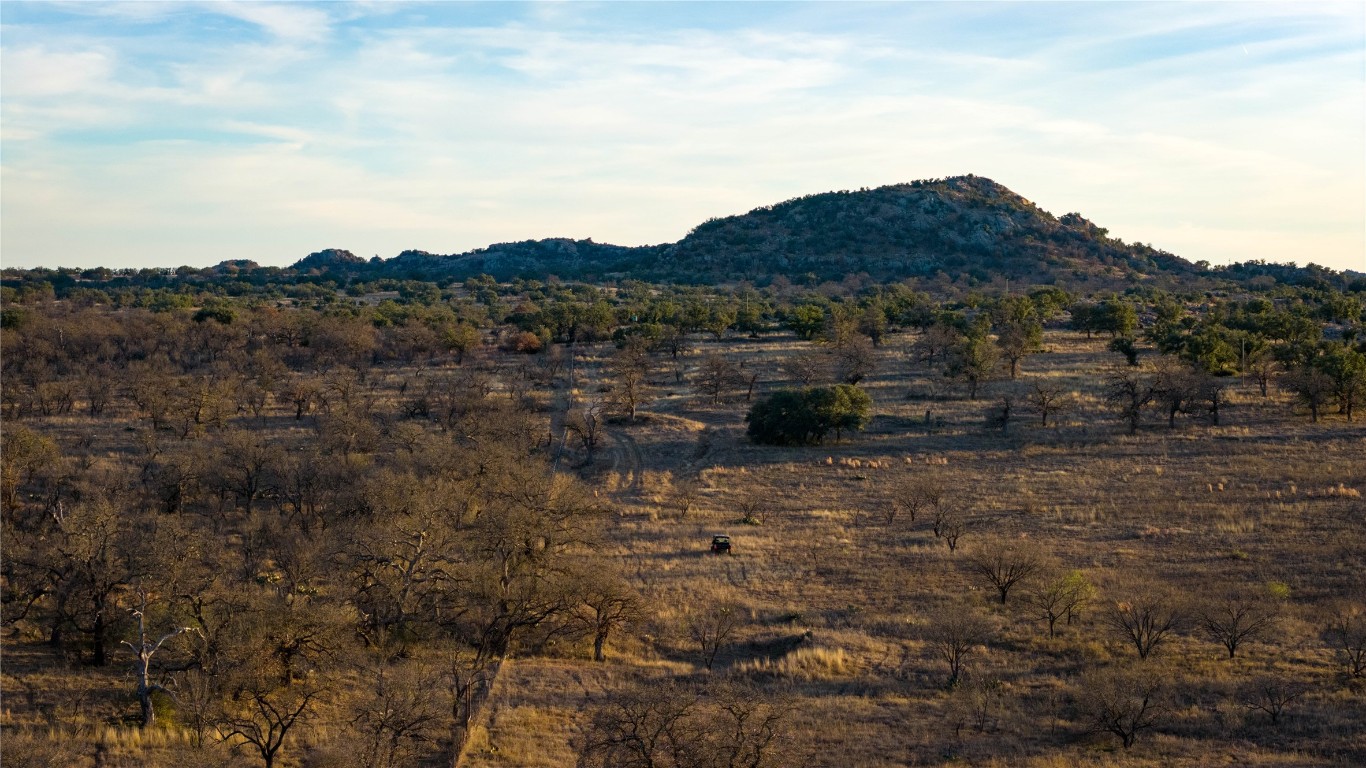 126 Buffalo Rd Valley Spring Valley Spring, TX 76885 - Photo 34 of 39 a view of a large mountain with a field