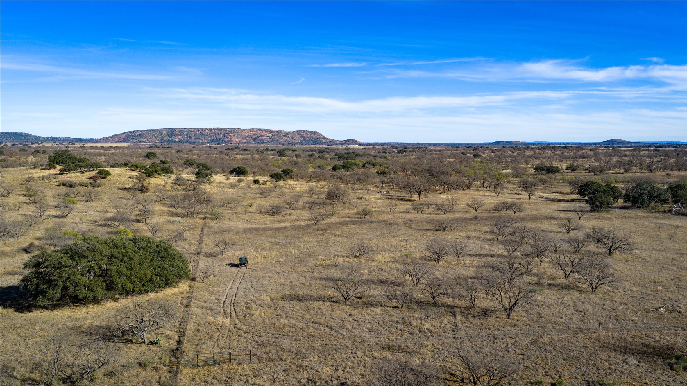 126 Buffalo Rd Valley Spring Valley Spring, TX 76885 - Photo 35 of 39 View of mountain background with rural landscape and a desert landscape