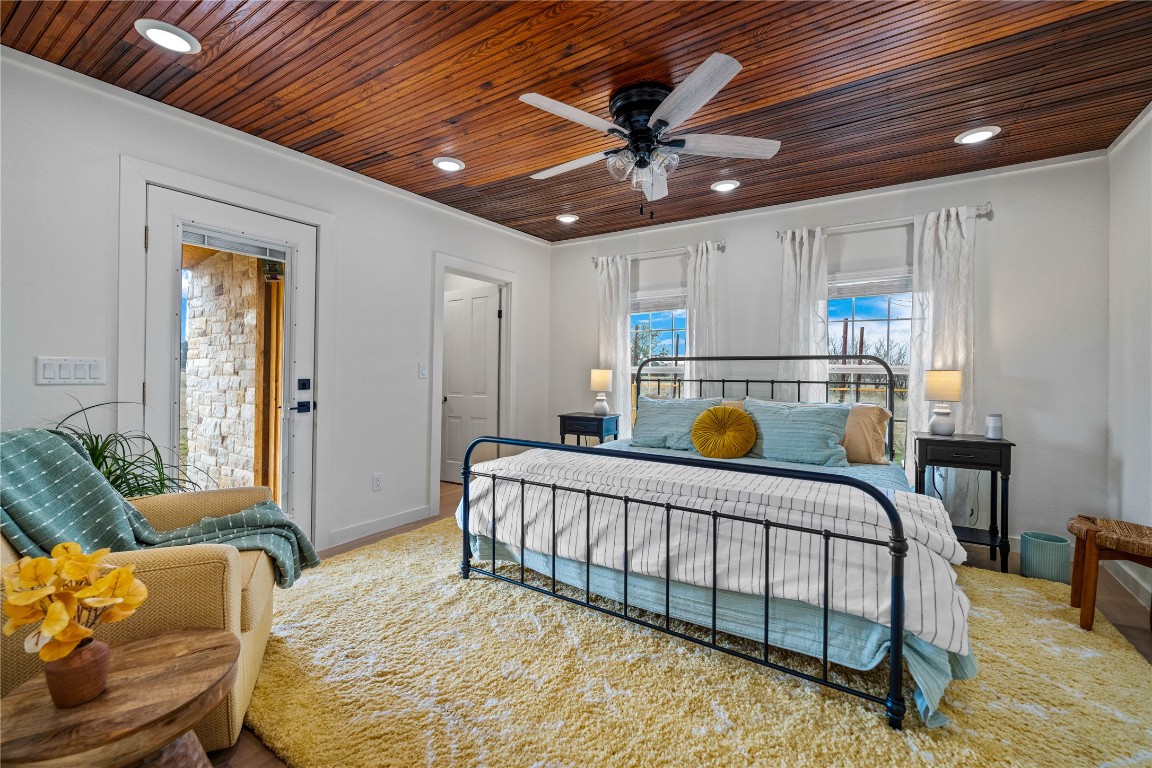 126 Buffalo Rd Valley Spring Valley Spring, TX 76885 - Photo 8 of 39 a bedroom with furniture and a chandelier