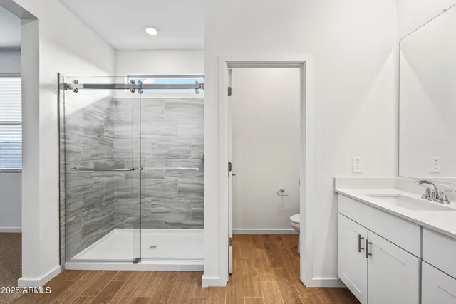 a bathroom with a shower and a sink