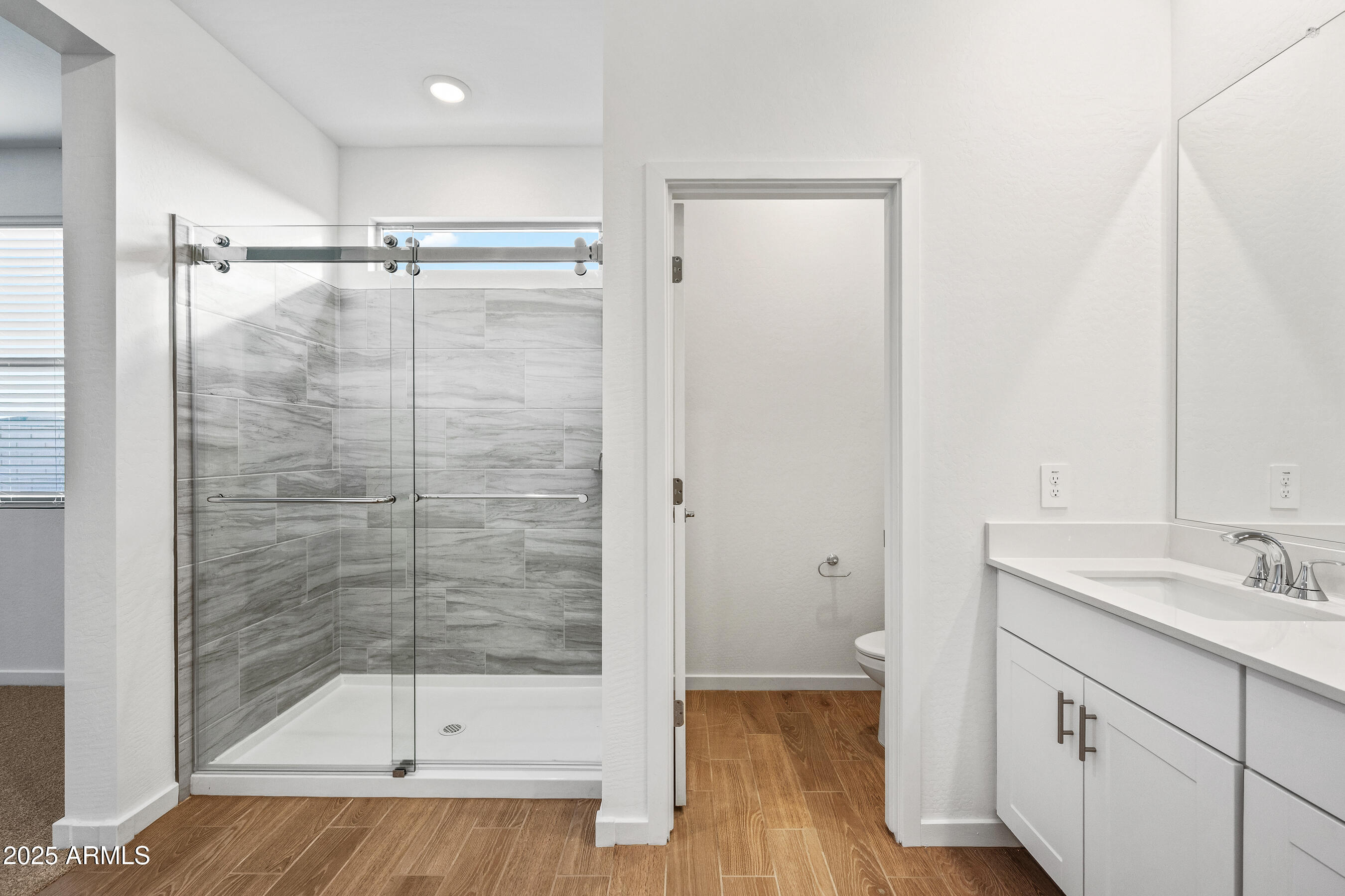 15825 West Gray Fox Trail Surprise, AZ 85387 - Photo 17 of 38 a bathroom with a shower and a sink