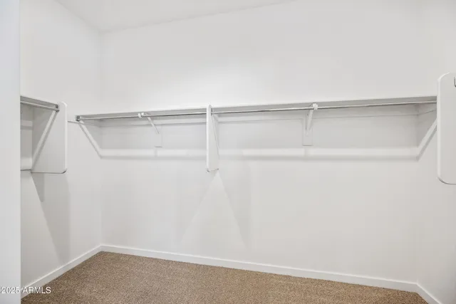 a view of an empty walk in closet