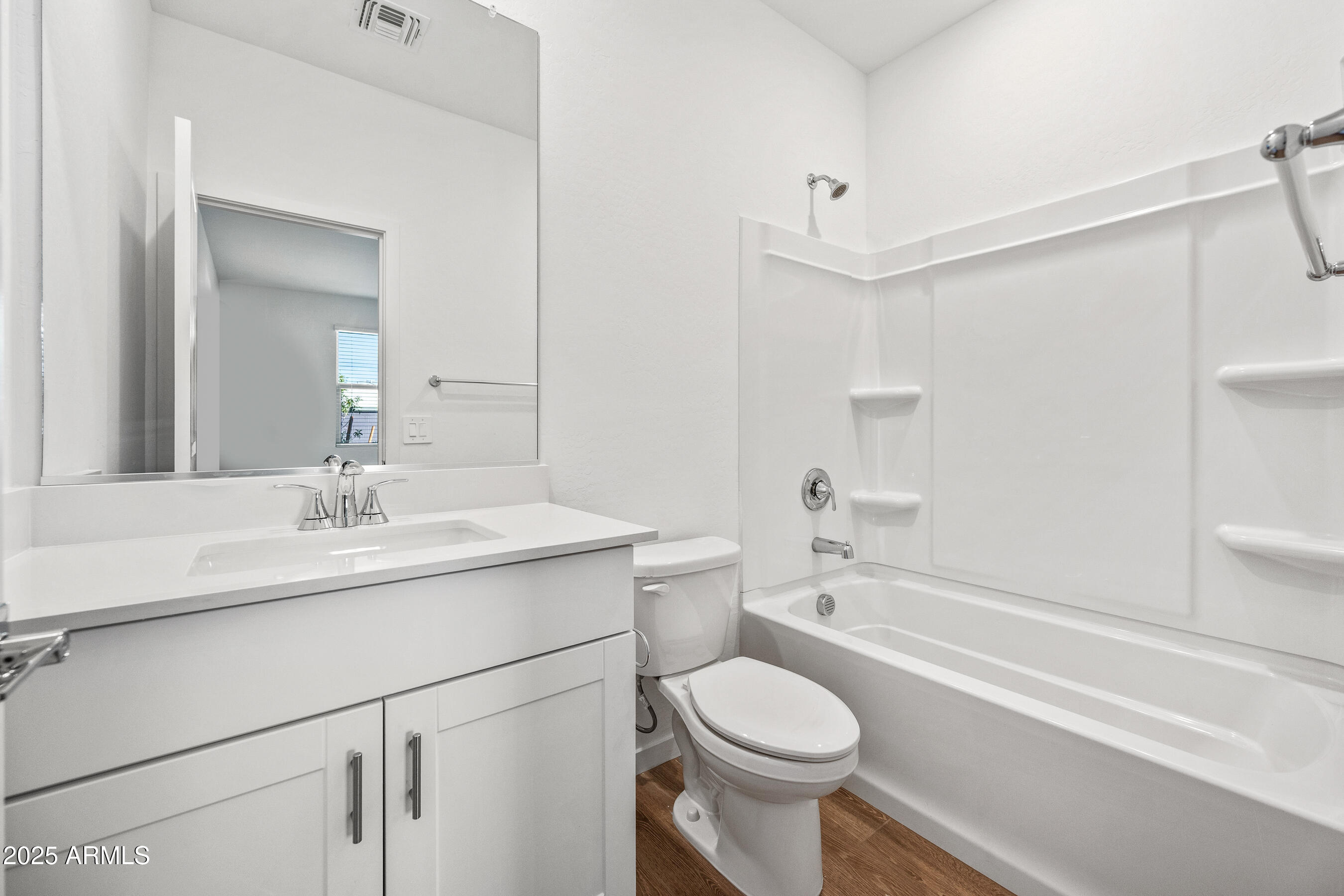 15825 West Gray Fox Trail Surprise, AZ 85387 - Photo 21 of 38 a bathroom with a sink a toilet and shower