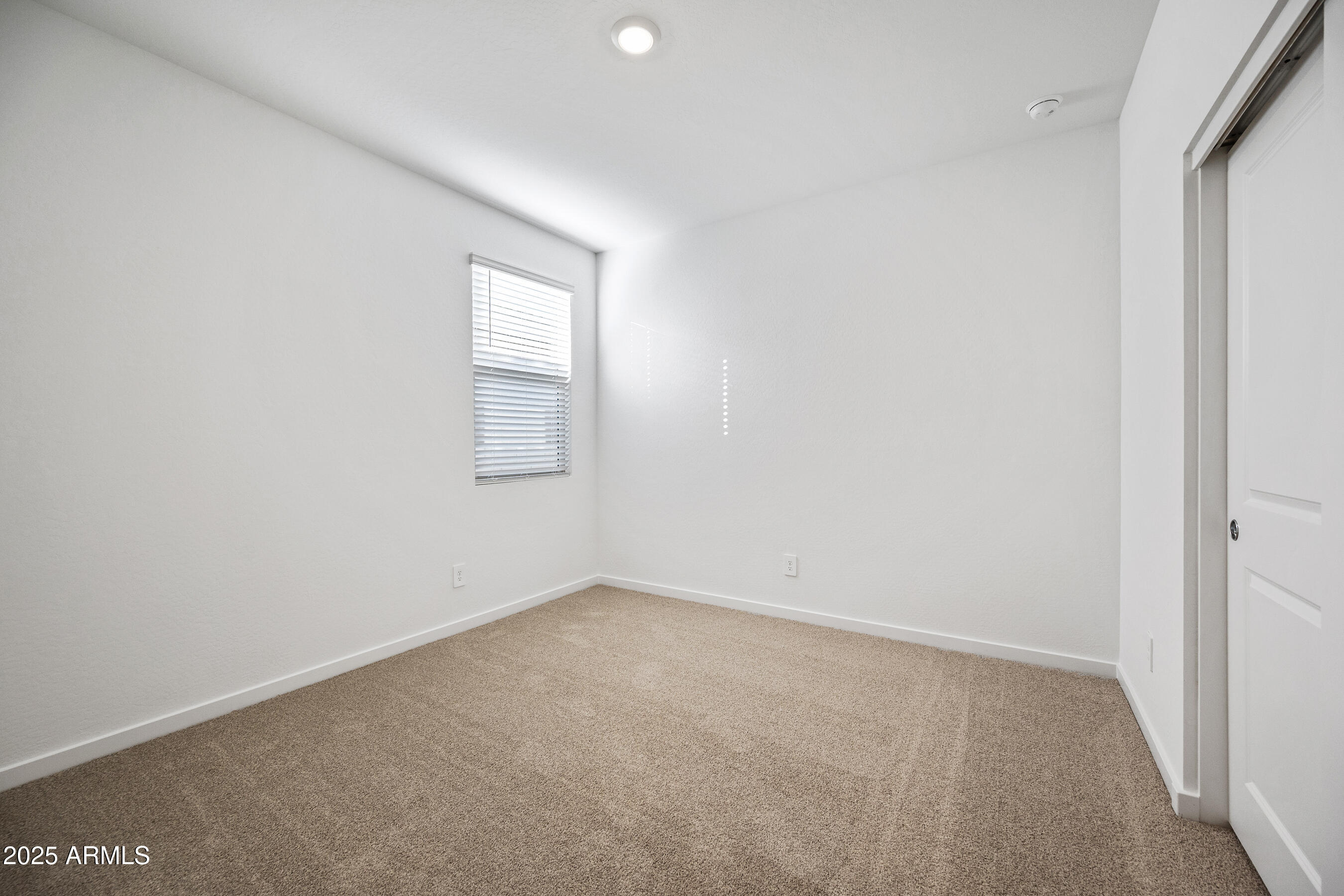 15825 West Gray Fox Trail Surprise, AZ 85387 - Photo 24 of 38 a view of an empty room with a window