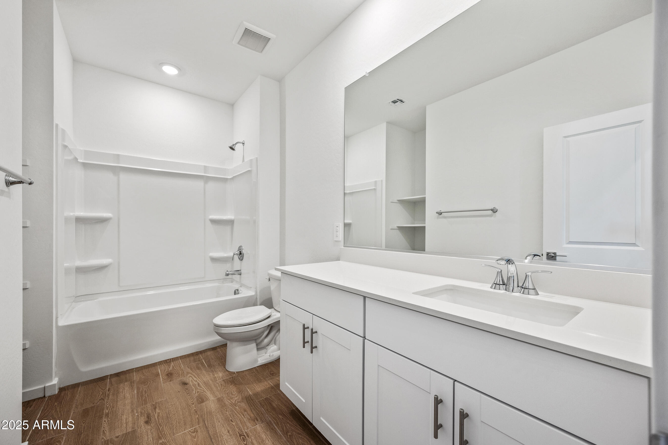 15825 West Gray Fox Trail Surprise, AZ 85387 - Photo 25 of 38 a spacious bathroom with a shower sink vanity mirror and toilet