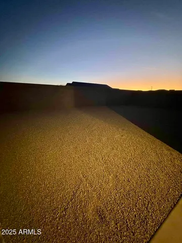 an aerial view of a house with a swimming pool