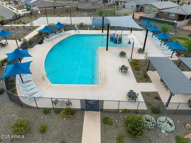 a view of a swimming pool with seating area