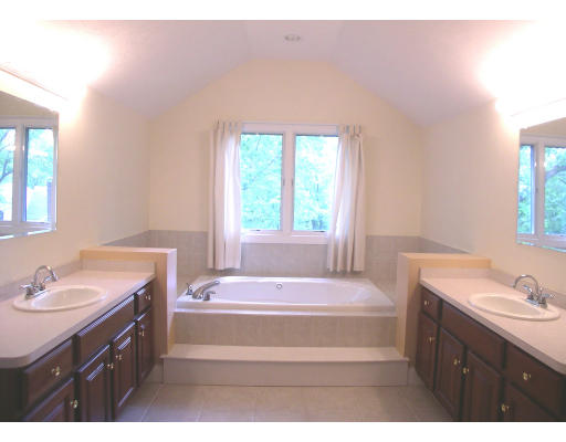 30 Edwardel Road Needham, MA 02492 - Photo 12 of 14 a bathroom with a tub sink and mirror