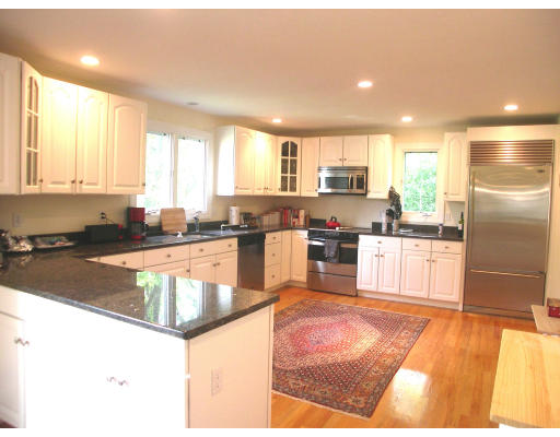 30 Edwardel Road Needham, MA 02492 - Photo 5 of 14 a kitchen with stainless steel appliances granite countertop a stove a sink and a refrigerator