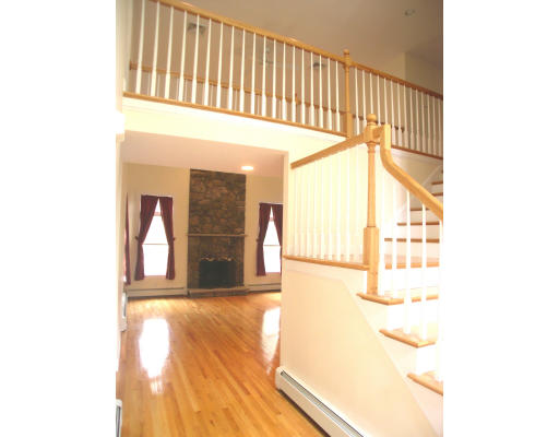 30 Edwardel Road Needham, MA 02492 - Photo 9 of 14 a view of a hallway with a large window and wooden floor