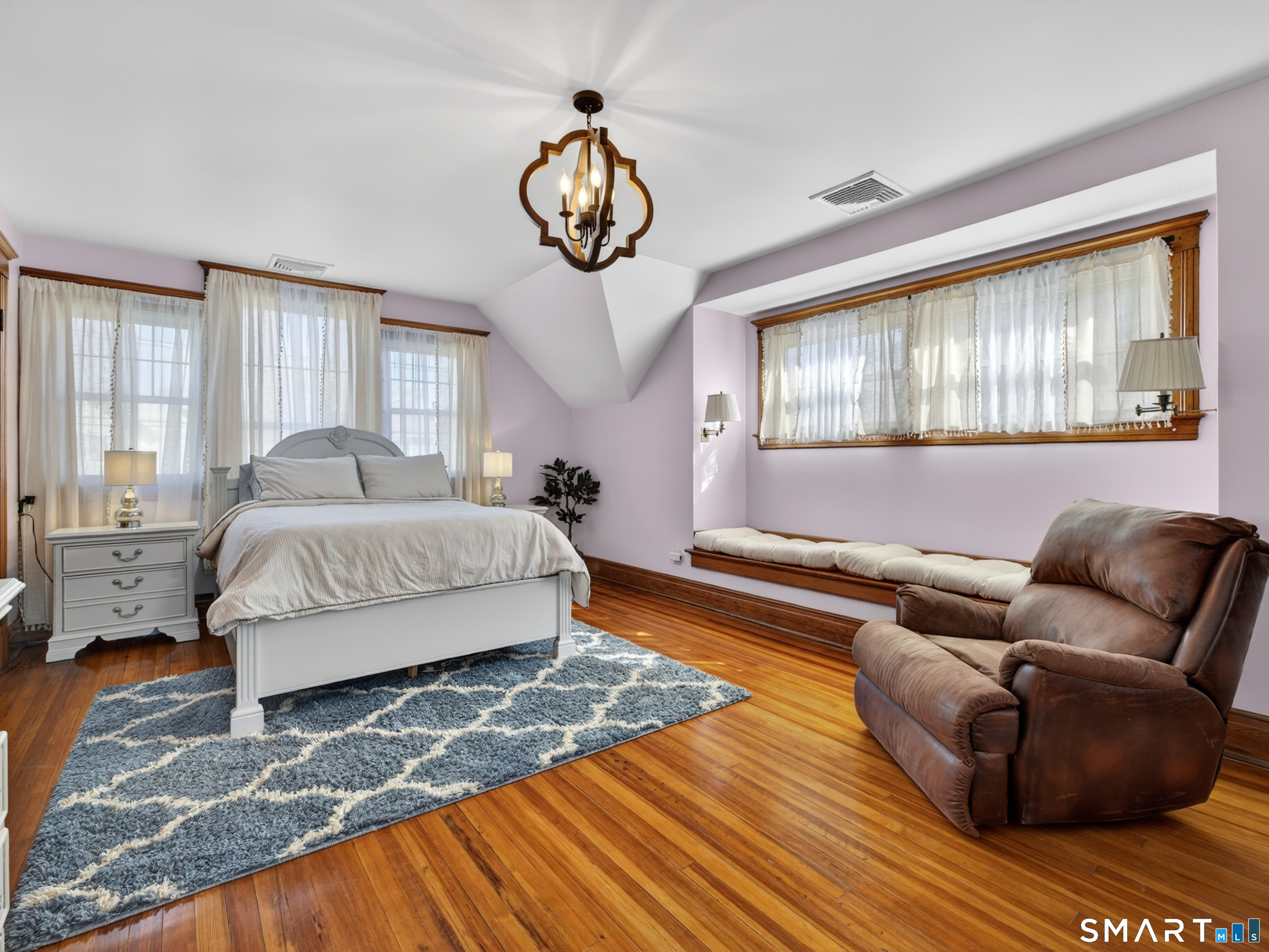 115 West Thames Street Norwich, CT 06360 - Photo 27 of 40 a living room with furniture and a large window