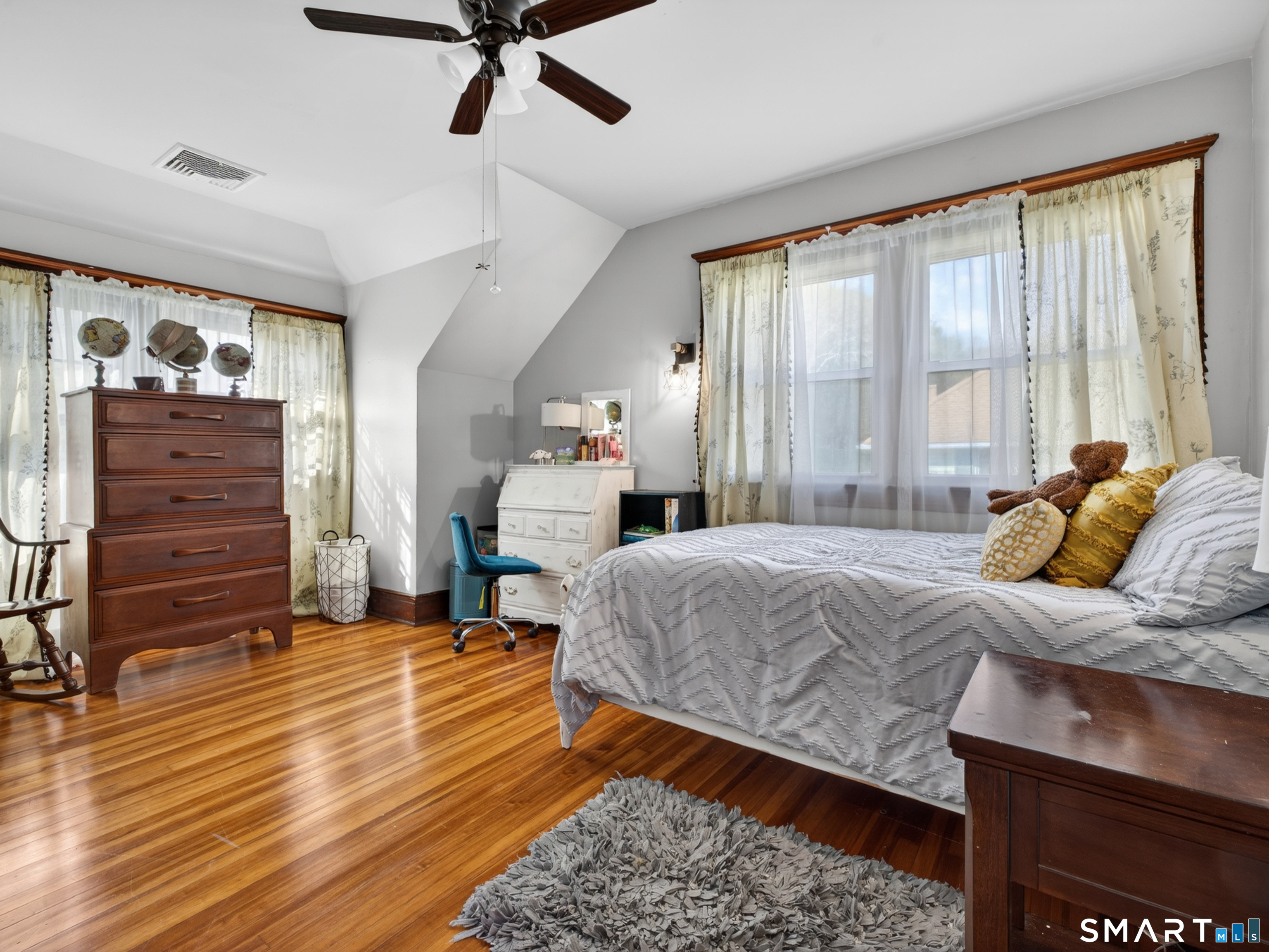 115 West Thames Street Norwich, CT 06360 - Photo 34 of 40 a bedroom with a bed and wooden floor