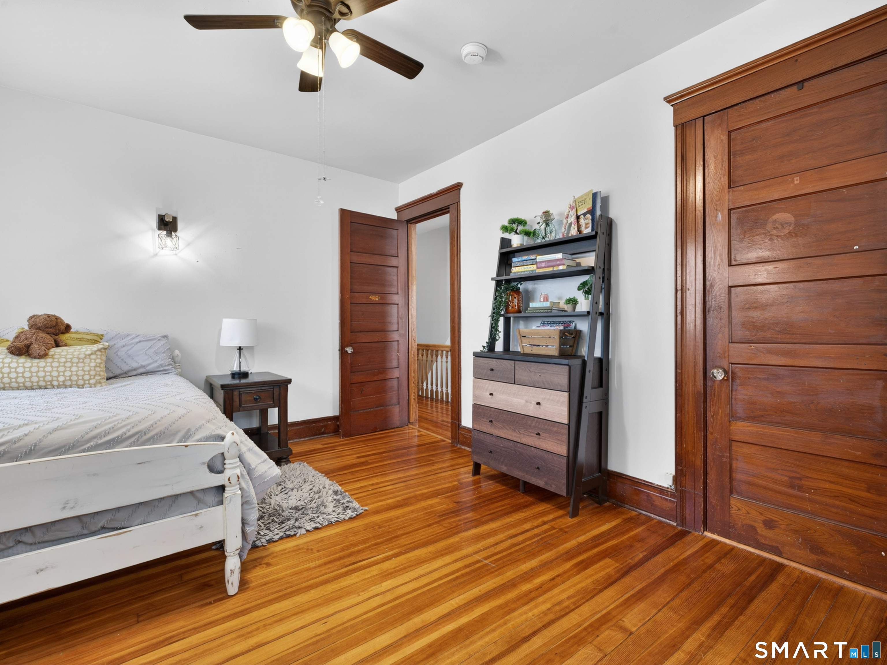 115 West Thames Street Norwich, CT 06360 - Photo 36 of 40 a bedroom with a bed and a cabinets