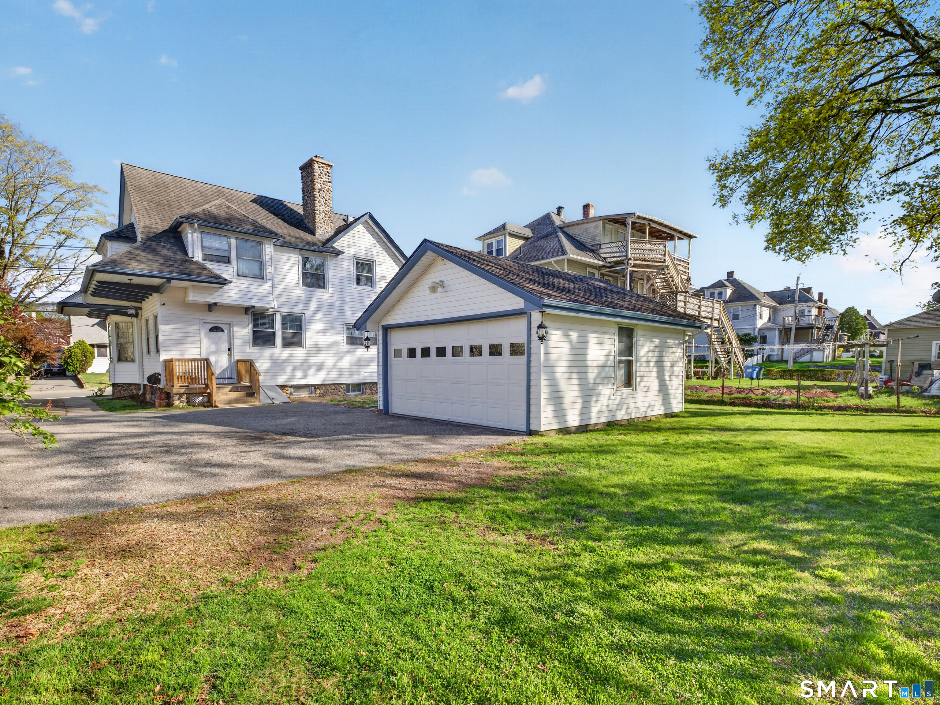 115 West Thames Street Norwich, CT 06360 - Photo 37 of 40 a view of a big house with a big yard and large trees