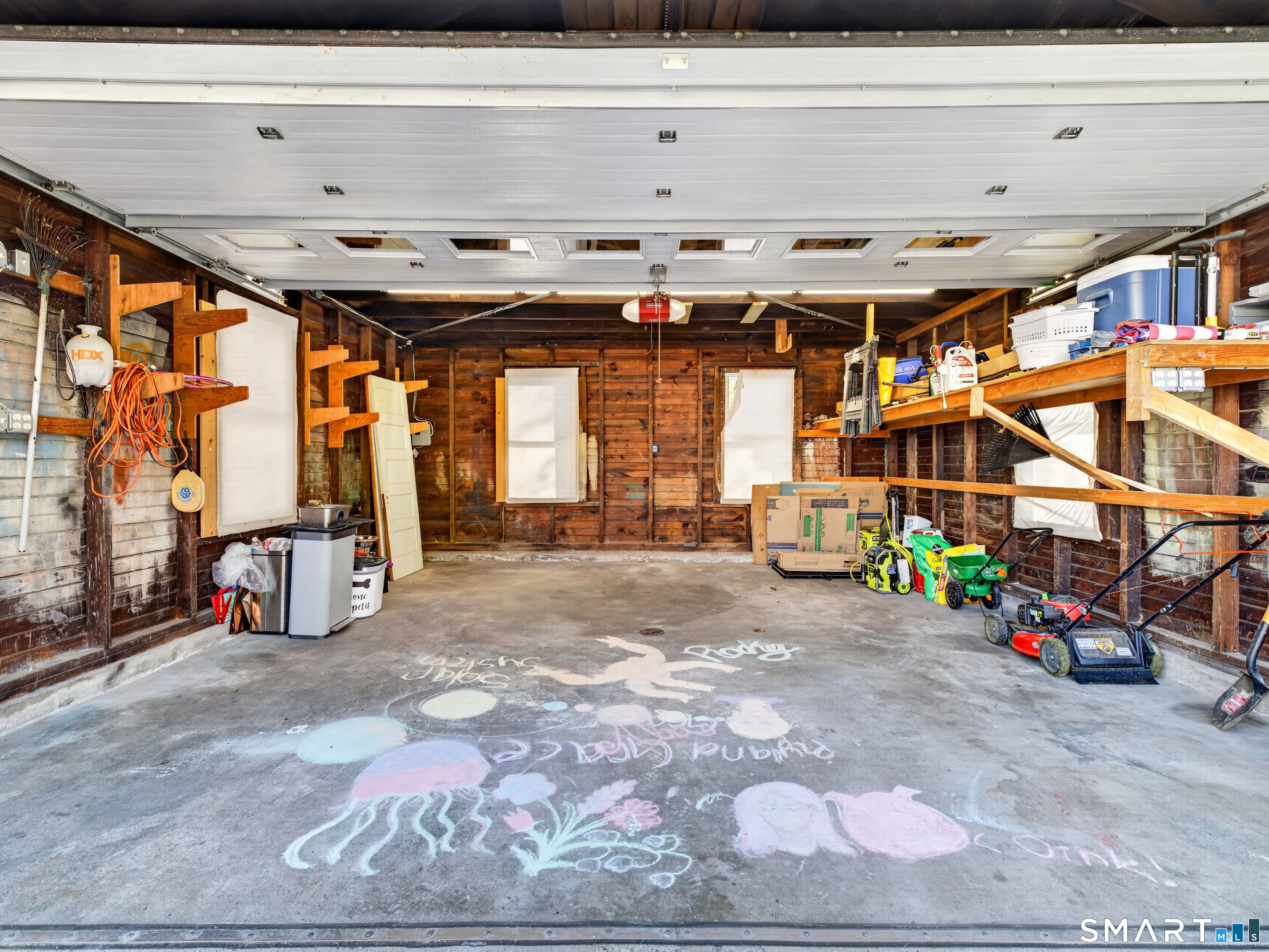 115 West Thames Street Norwich, CT 06360 - Photo 40 of 40 a view of a garage with an white wooden bed