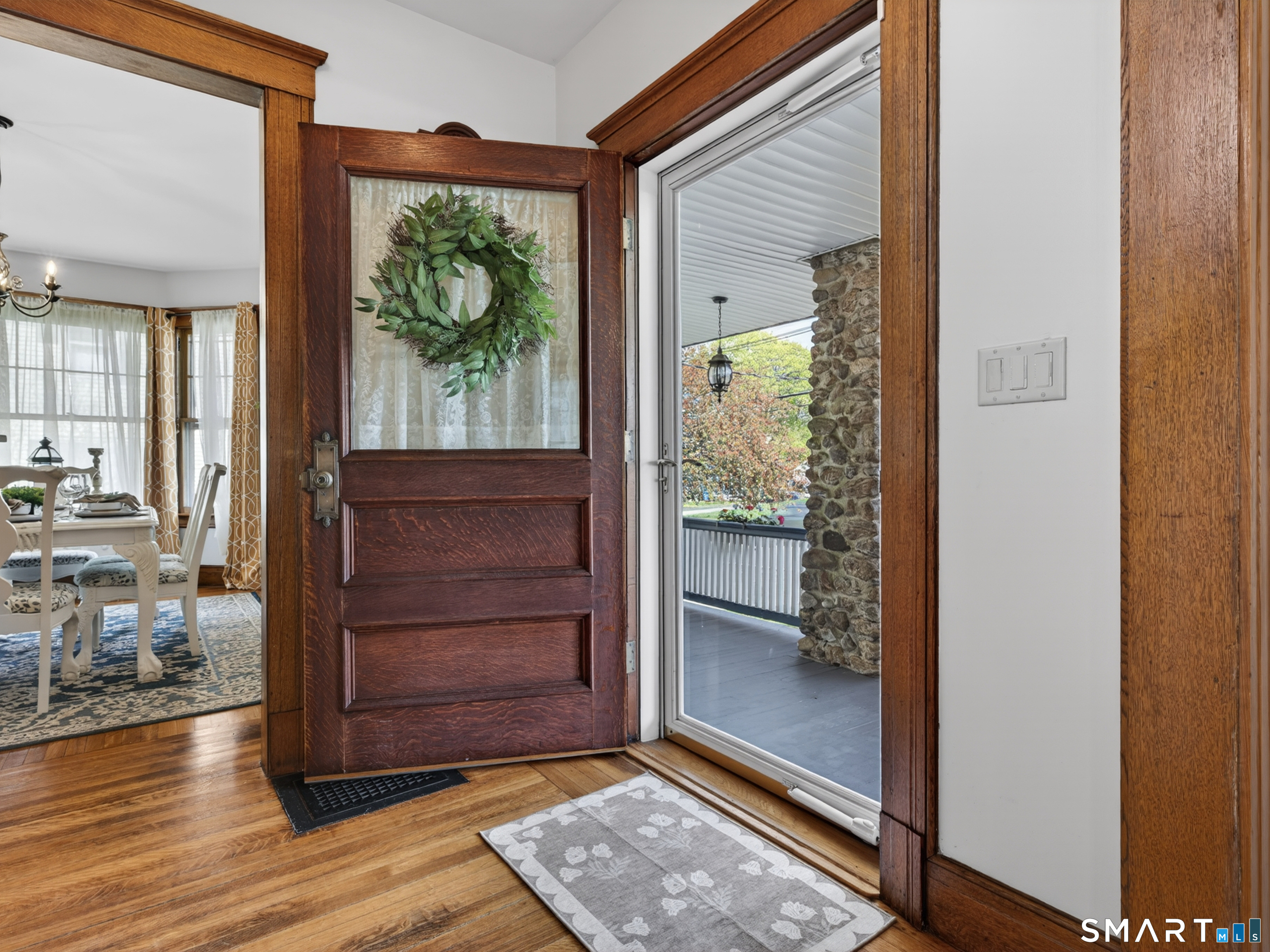 115 West Thames Street Norwich, CT 06360 - Photo 10 of 40 a view of a hallway with wooden floor and windows