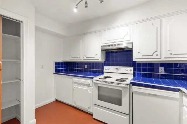 a kitchen with a stove and a microwave