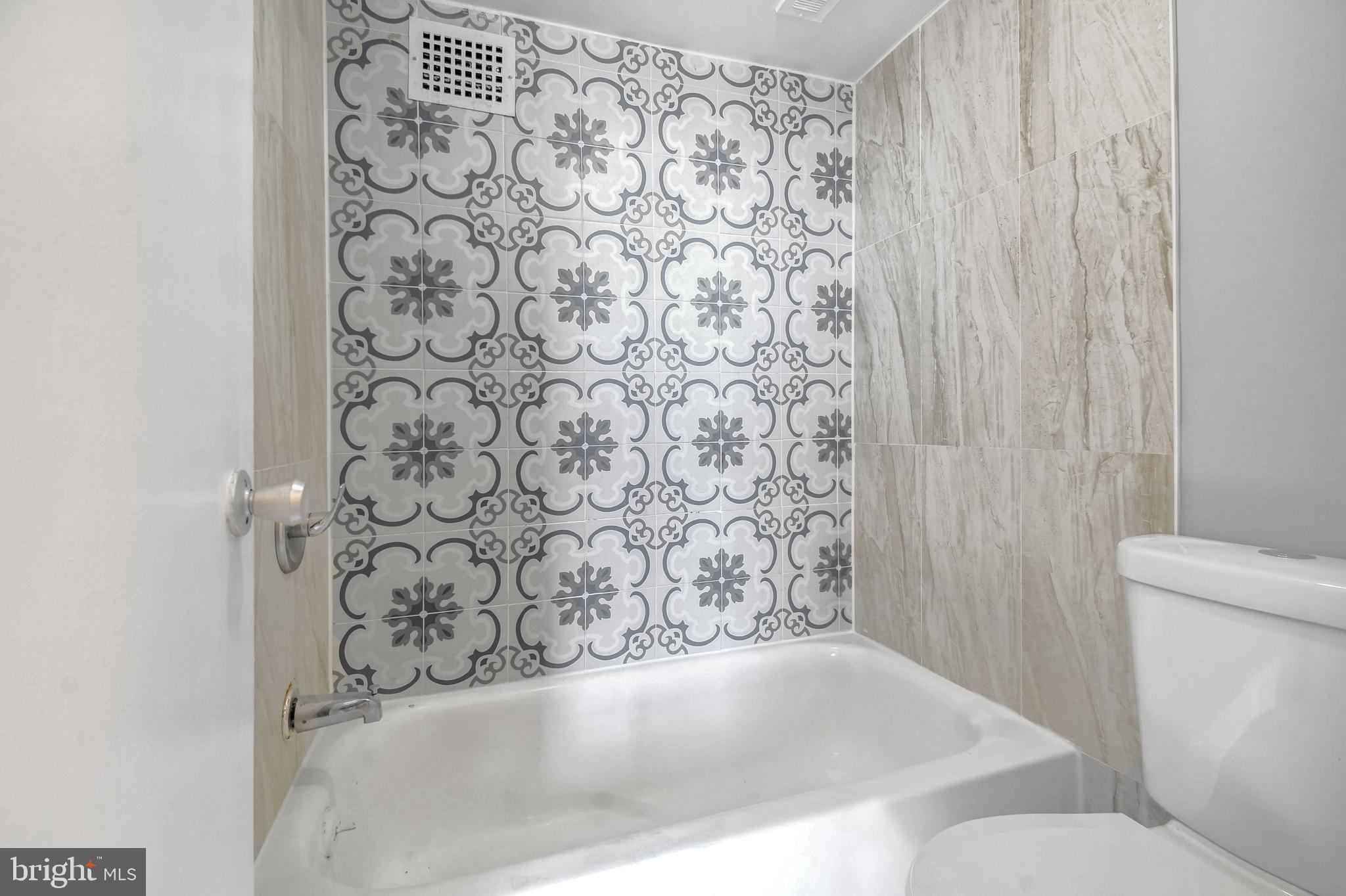 1836 Metzerott Road, Unit 925 Hyattsville, MD 20783 - Photo 19 of 33 a bathroom with a bathtub and shower