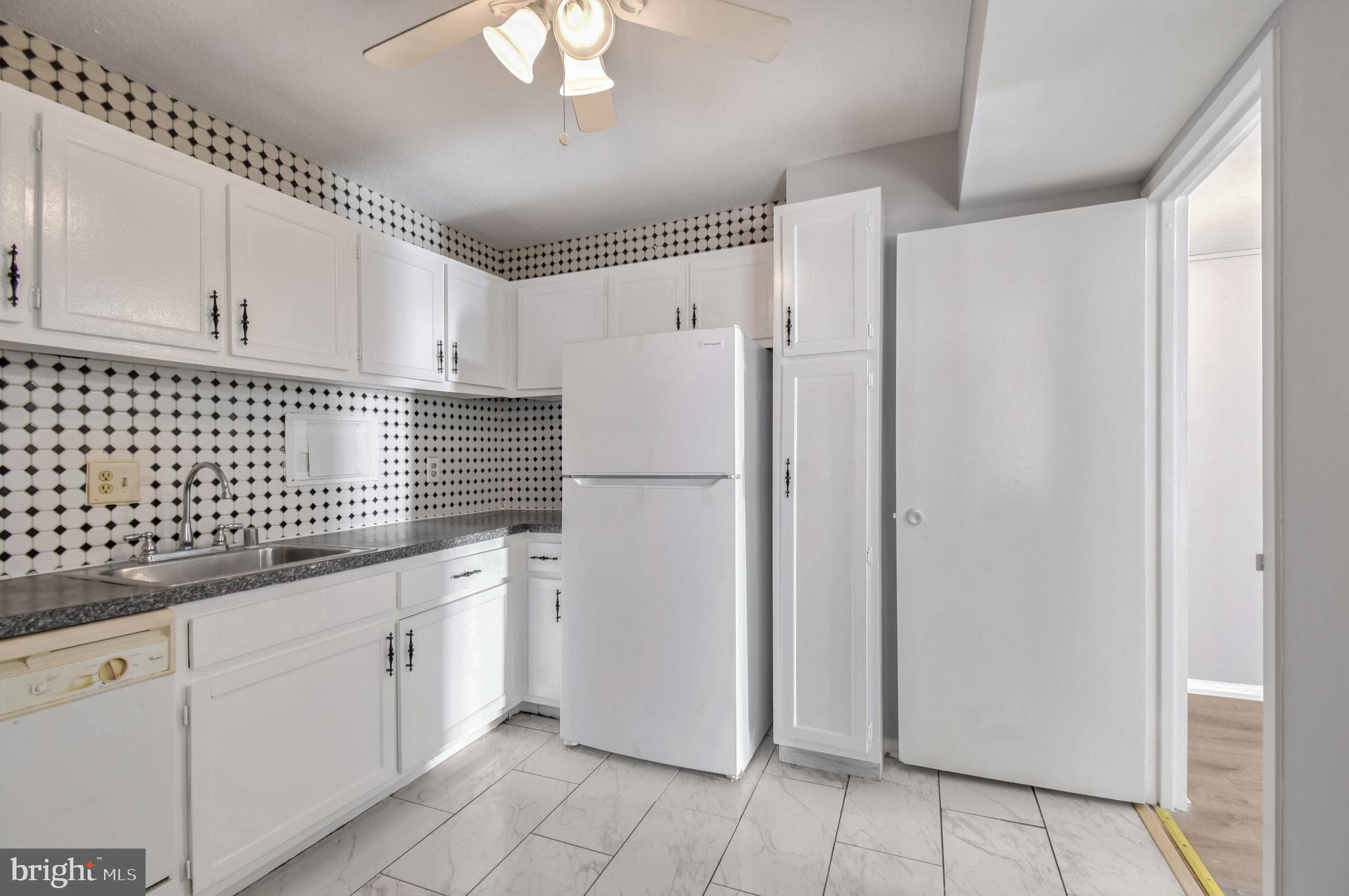 1836 Metzerott Road, Unit 925 Hyattsville, MD 20783 - Photo 10 of 33 a kitchen with stainless steel appliances granite countertop a refrigerator sink and cabinets