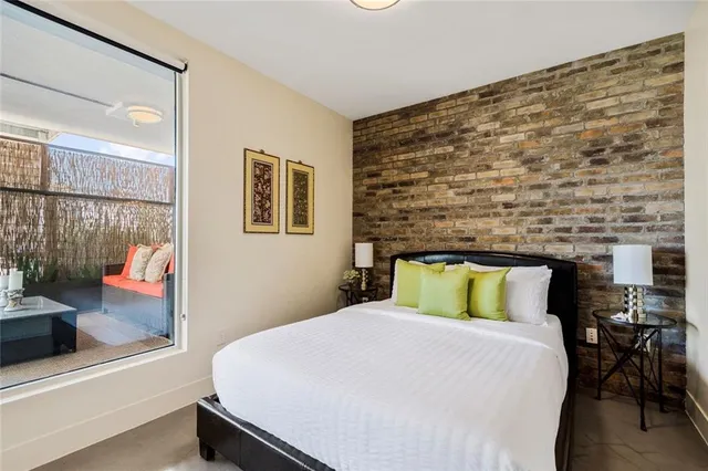 a bedroom with a bed and a fireplace