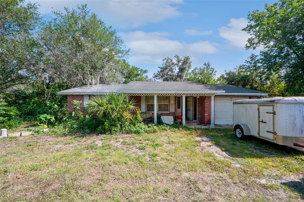 15943 Peace Boulevard Spring Hill, FL 34610 - Photo 1 of 1 a view of a house with a yard