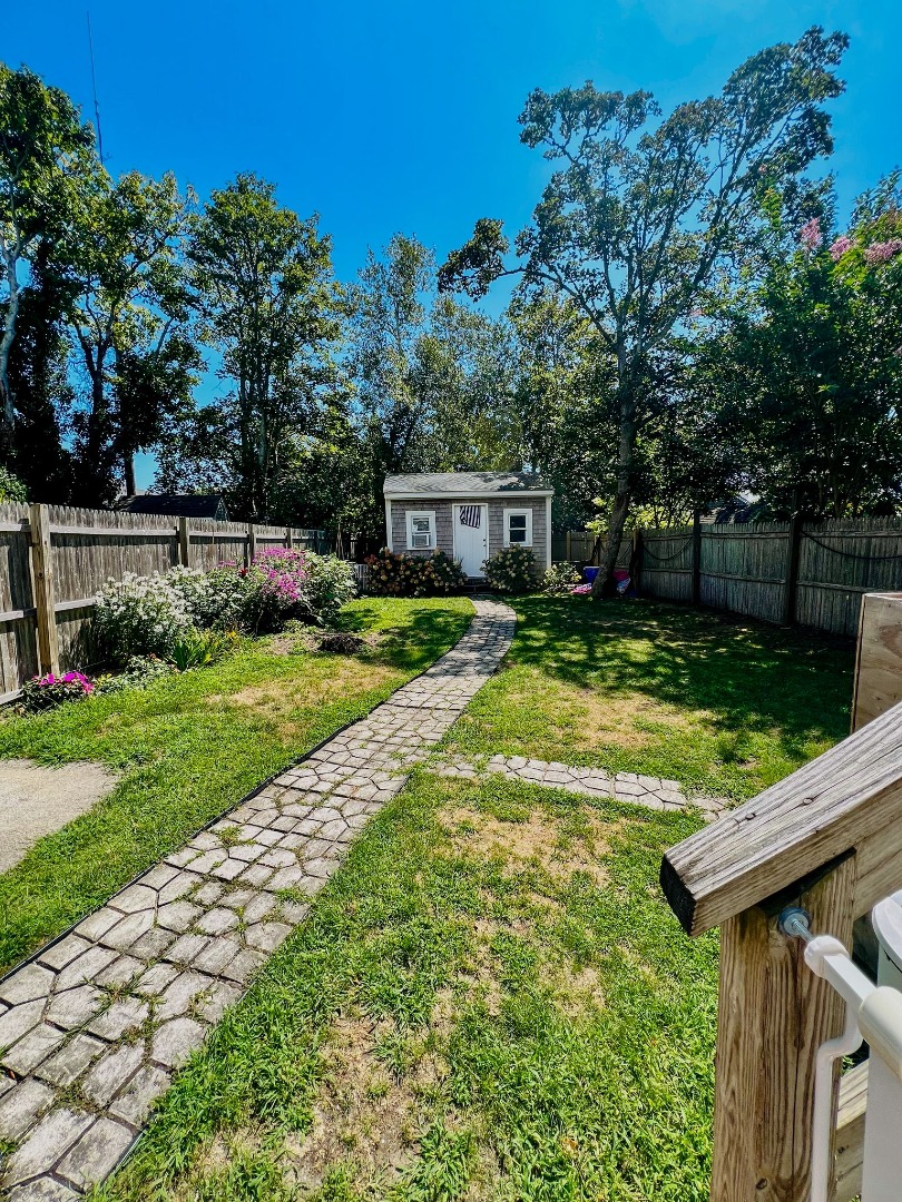 48 West Tisbury Road Edgartown, MA 02539 - Photo 3 of 8 a view of a house with backyard and sitting area