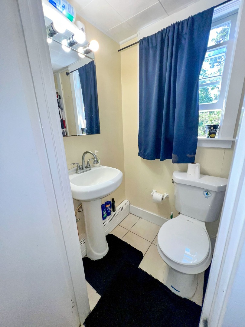 48 West Tisbury Road Edgartown, MA 02539 - Photo 4 of 8 a bathroom with a sink a toilet and mirror