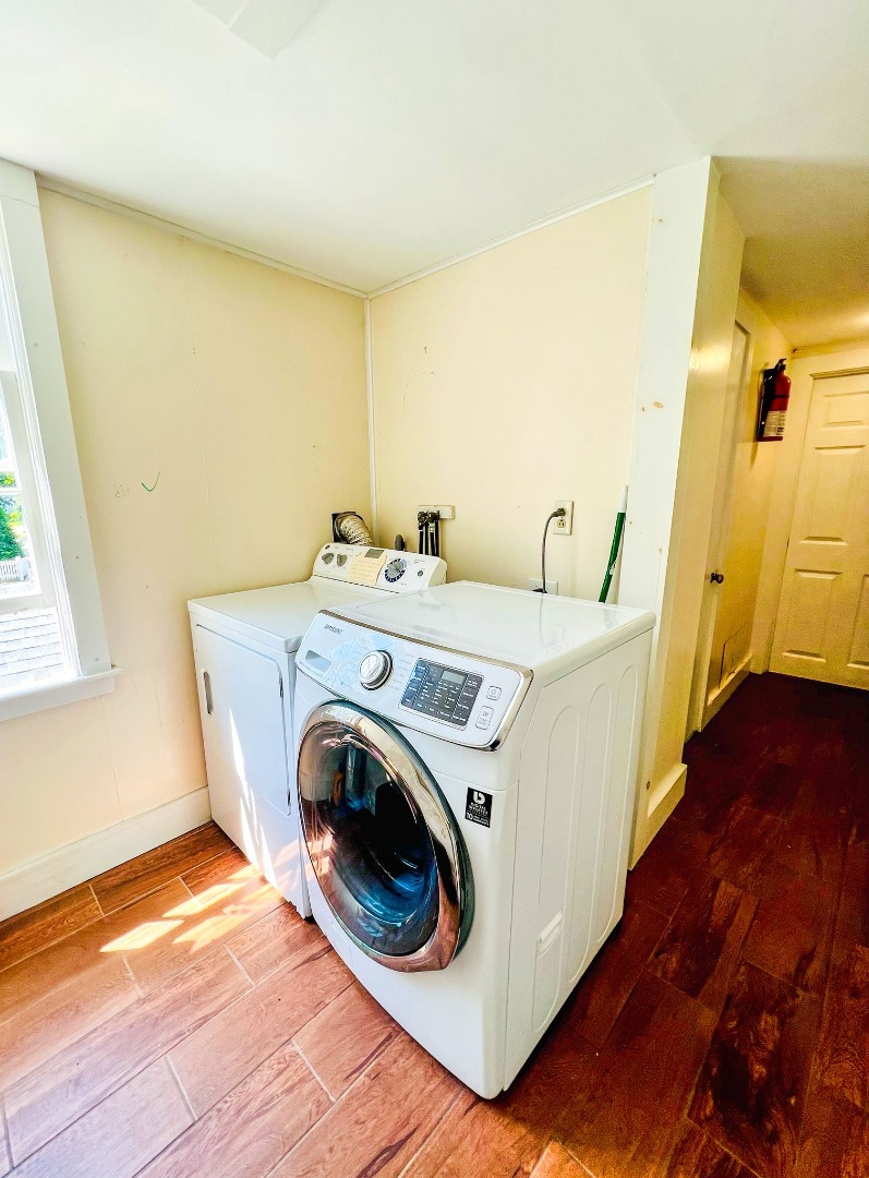 48 West Tisbury Road Edgartown, MA 02539 - Photo 5 of 8 a utility room with wooden floor washer and dryer