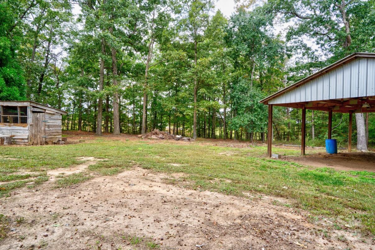 2026 Rehobeth Church Road Shelby, NC 28150 - Photo 11 of 48 a view of a house with backyard and trees
