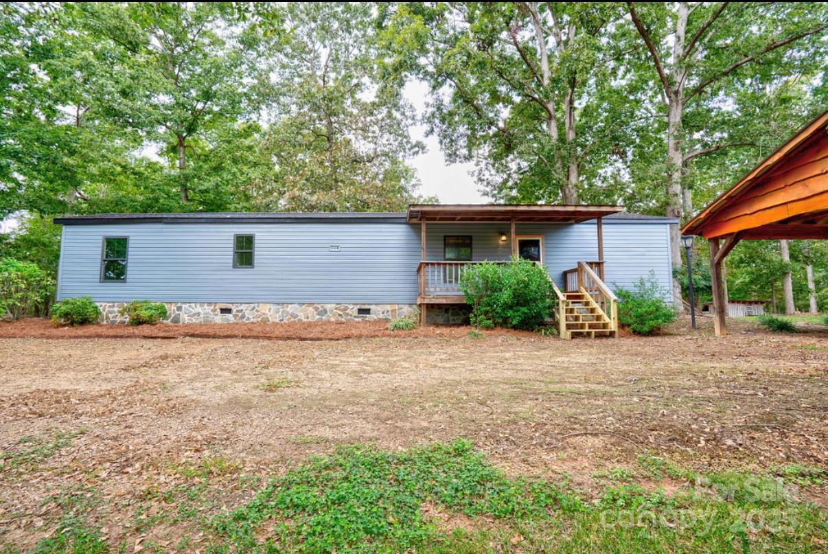 2026 Rehobeth Church Road Shelby, NC 28150 - Photo 19 of 48 a front view of house with small garden and tree
