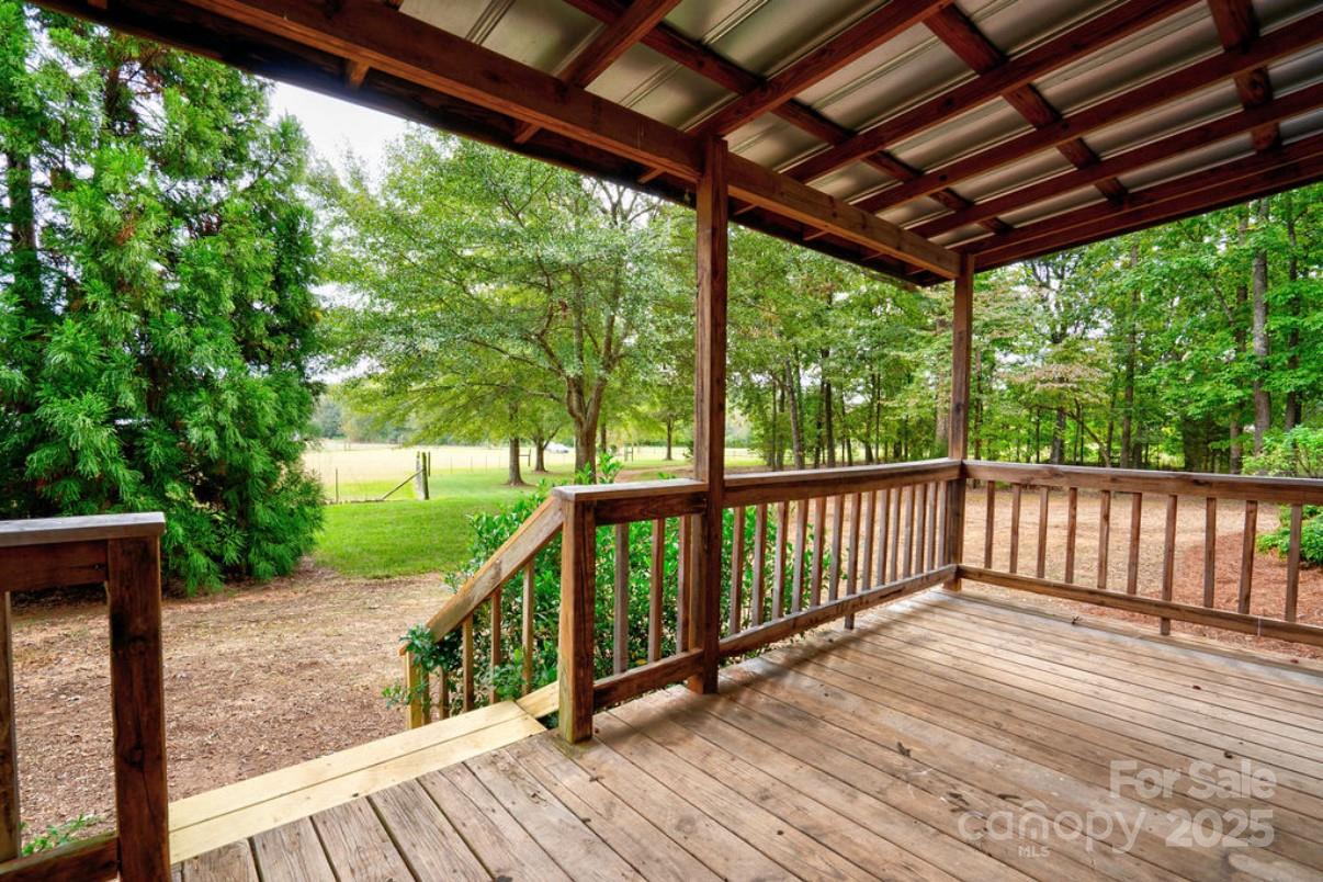 2026 Rehobeth Church Road Shelby, NC 28150 - Photo 21 of 48 a view of a wooden deck next to a yard