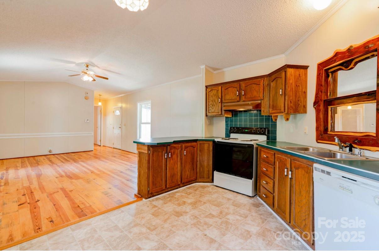 2026 Rehobeth Church Road Shelby, NC 28150 - Photo 26 of 48 a kitchen with stainless steel appliances granite countertop a refrigerator and a sink