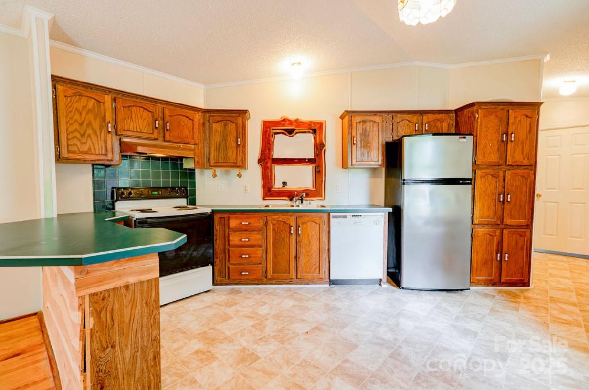 2026 Rehobeth Church Road Shelby, NC 28150 - Photo 29 of 48 a kitchen with stainless steel appliances granite countertop a refrigerator and a stove