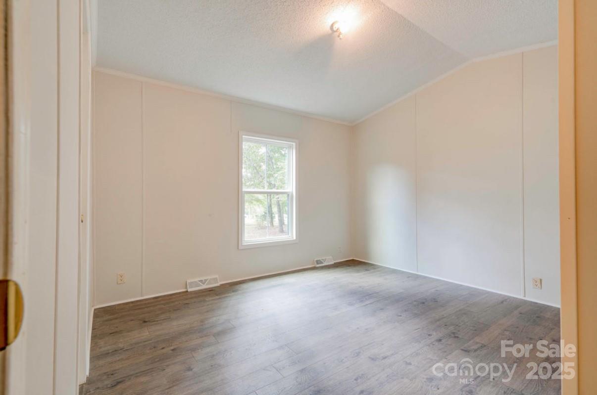 2026 Rehobeth Church Road Shelby, NC 28150 - Photo 30 of 48 an empty room with wooden floor and windows
