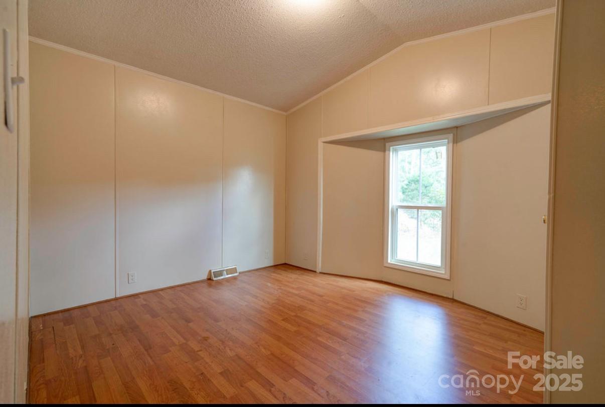 2026 Rehobeth Church Road Shelby, NC 28150 - Photo 38 of 48 an empty room with wooden floor and windows