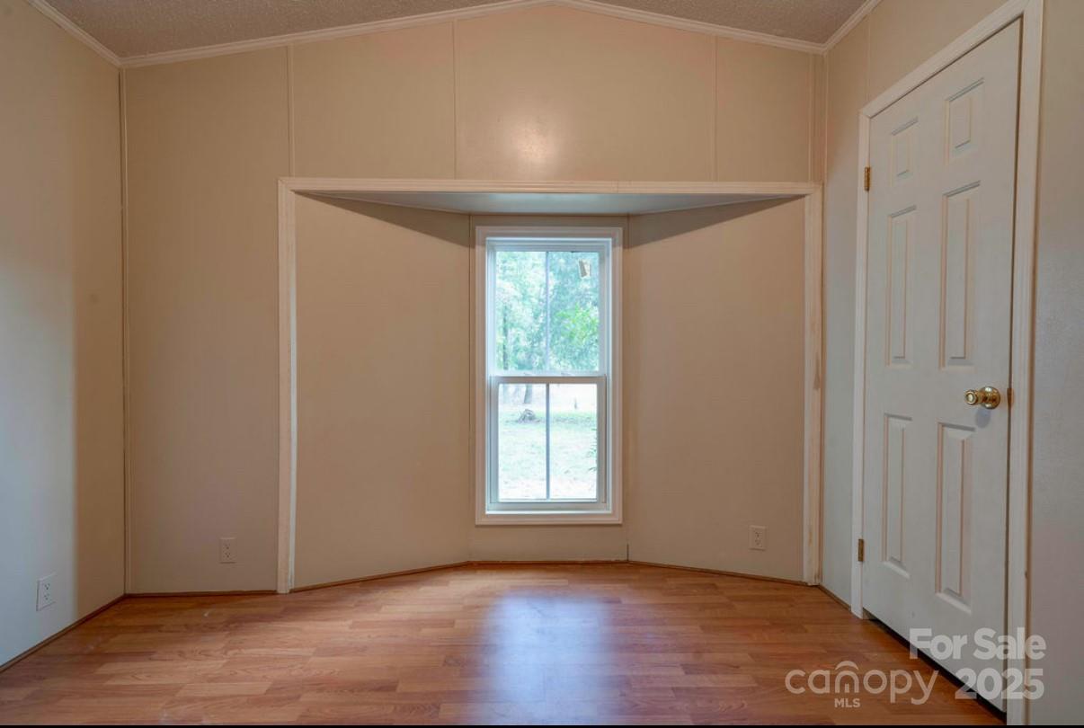 2026 Rehobeth Church Road Shelby, NC 28150 - Photo 39 of 48 a view of an empty room with wooden floor and a window