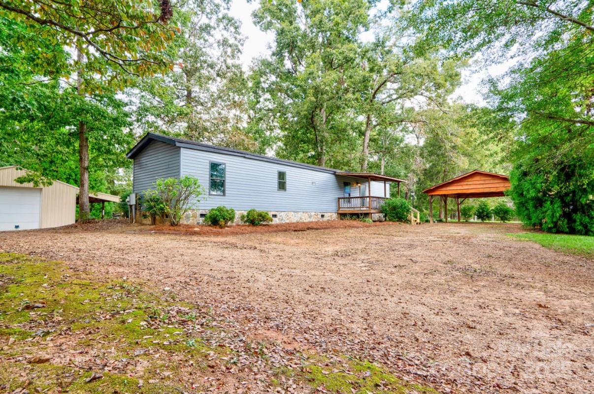 2026 Rehobeth Church Road Shelby, NC 28150 - Photo 4 of 48 a view of a house with backyard and a tree