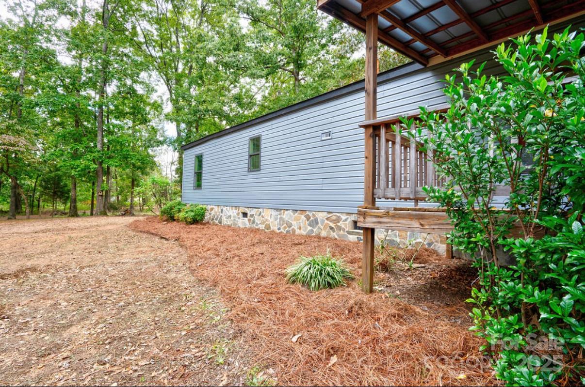 2026 Rehobeth Church Road Shelby, NC 28150 - Photo 45 of 48 a backyard of a house with plants and trees