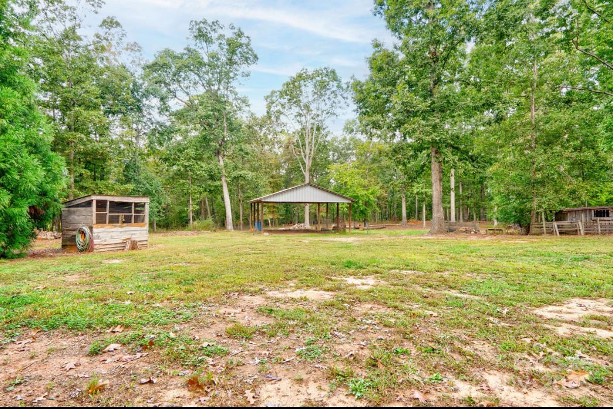2026 Rehobeth Church Road Shelby, NC 28150 - Photo 5 of 48 a backyard of a house with table and chairs