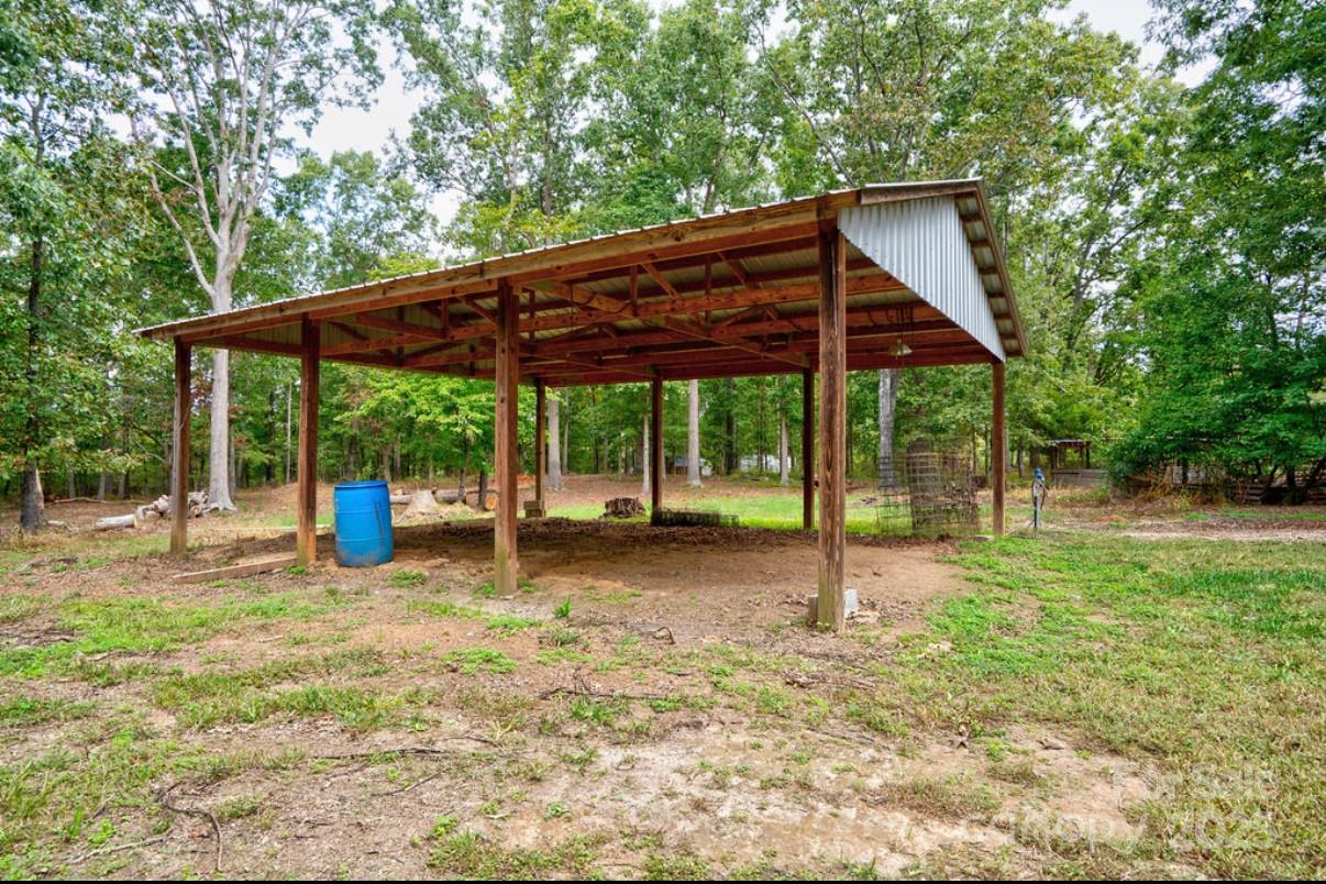 2026 Rehobeth Church Road Shelby, NC 28150 - Photo 8 of 48 a view of a wooden deck and a backyard