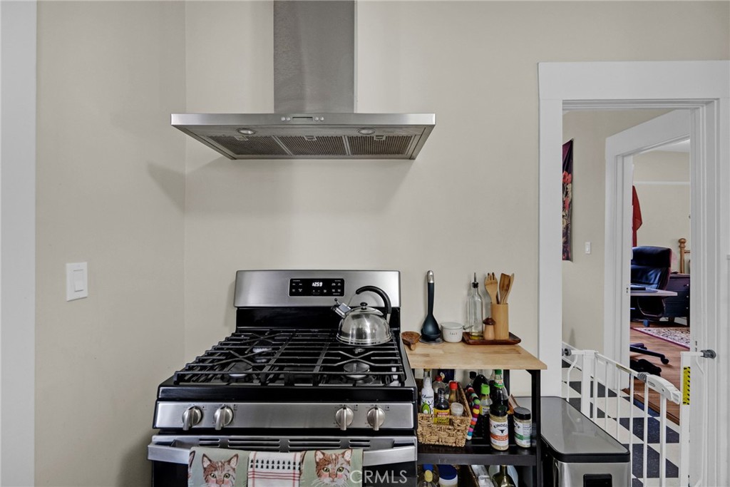 3744 Stoddard Avenue Riverside, CA 92501 - Photo 14 of 29 a kitchen with a stove and cabinets